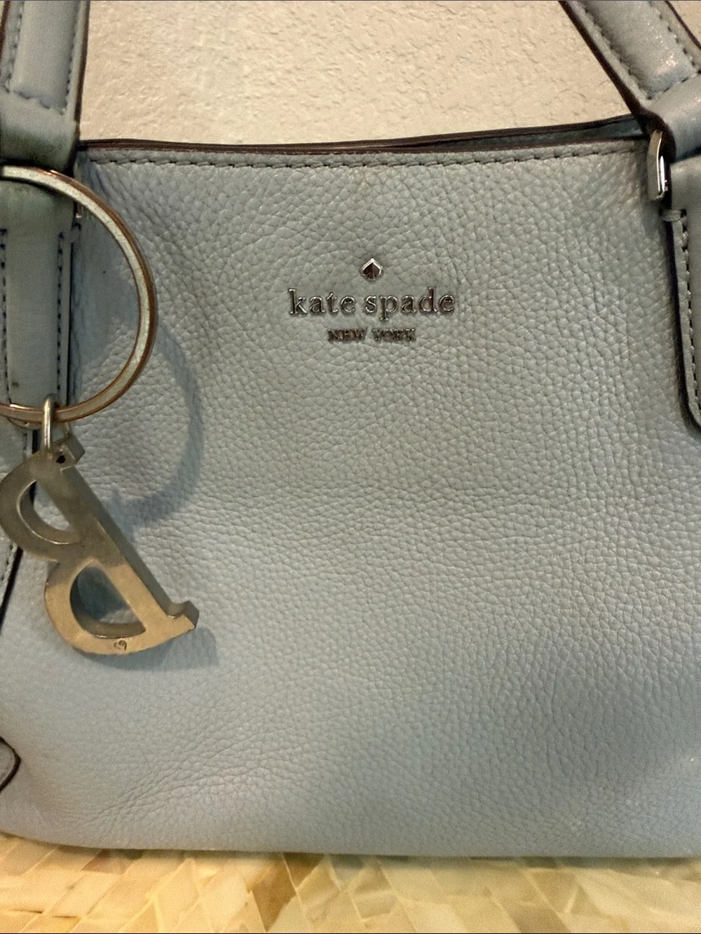 Kate Spade pale blue pebbled leather satchel with charm